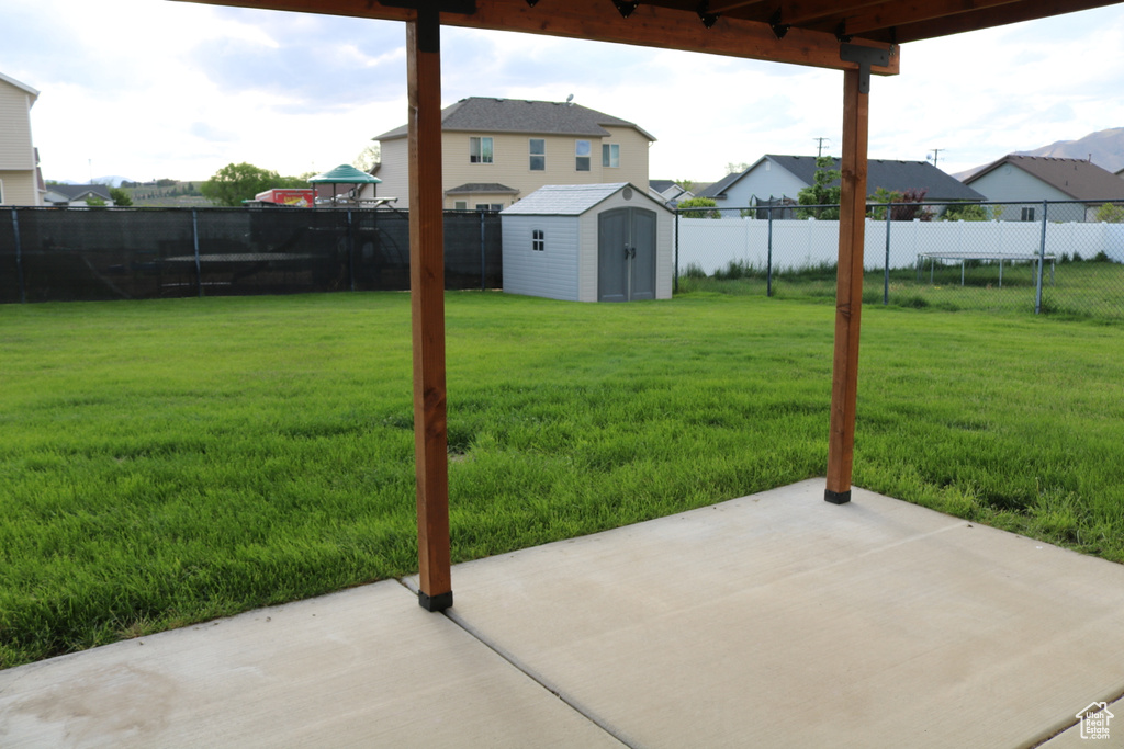 View of yard with a patio and a residential view