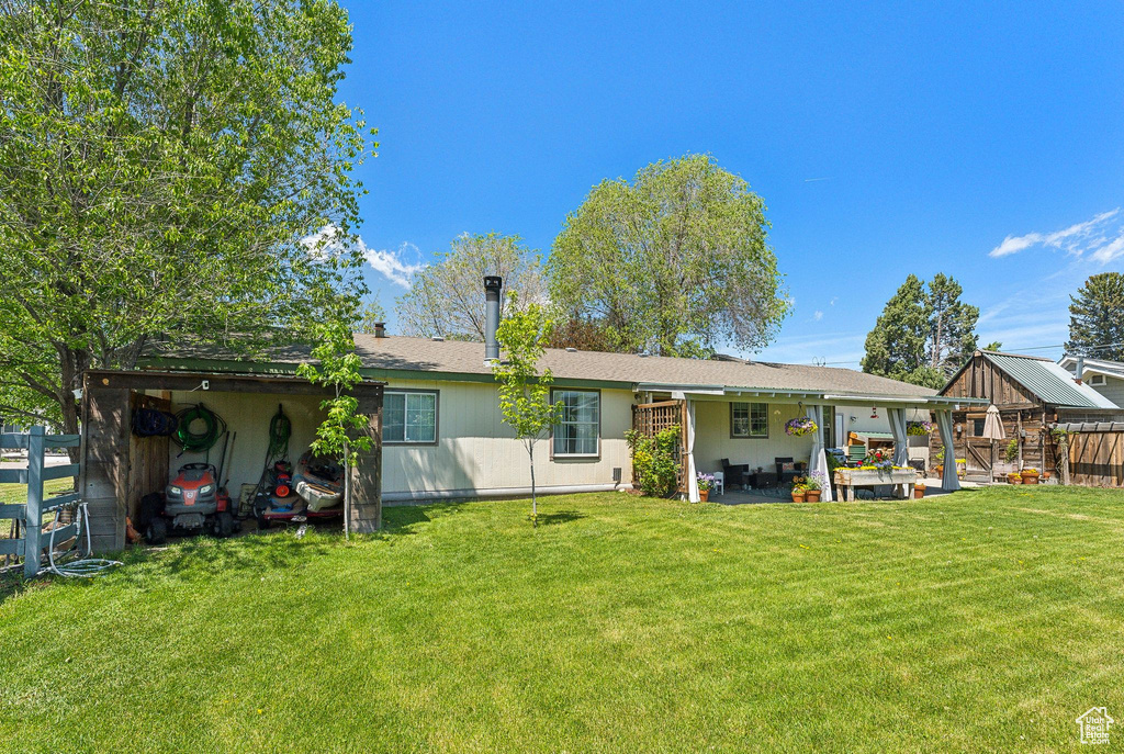 Back of property with a patio