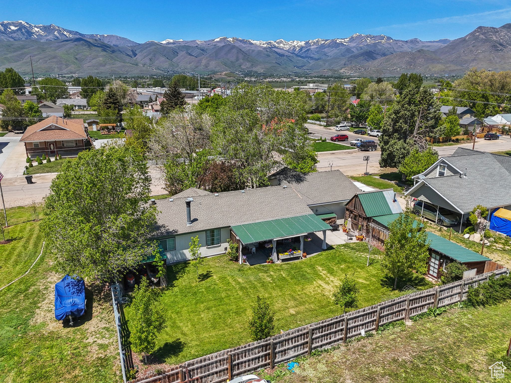 Aerial perspective of suburban area featuring a mountainous background