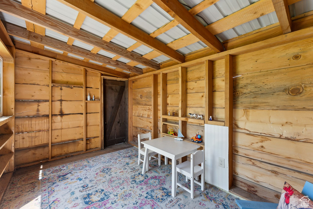 Miscellaneous room with wooden walls