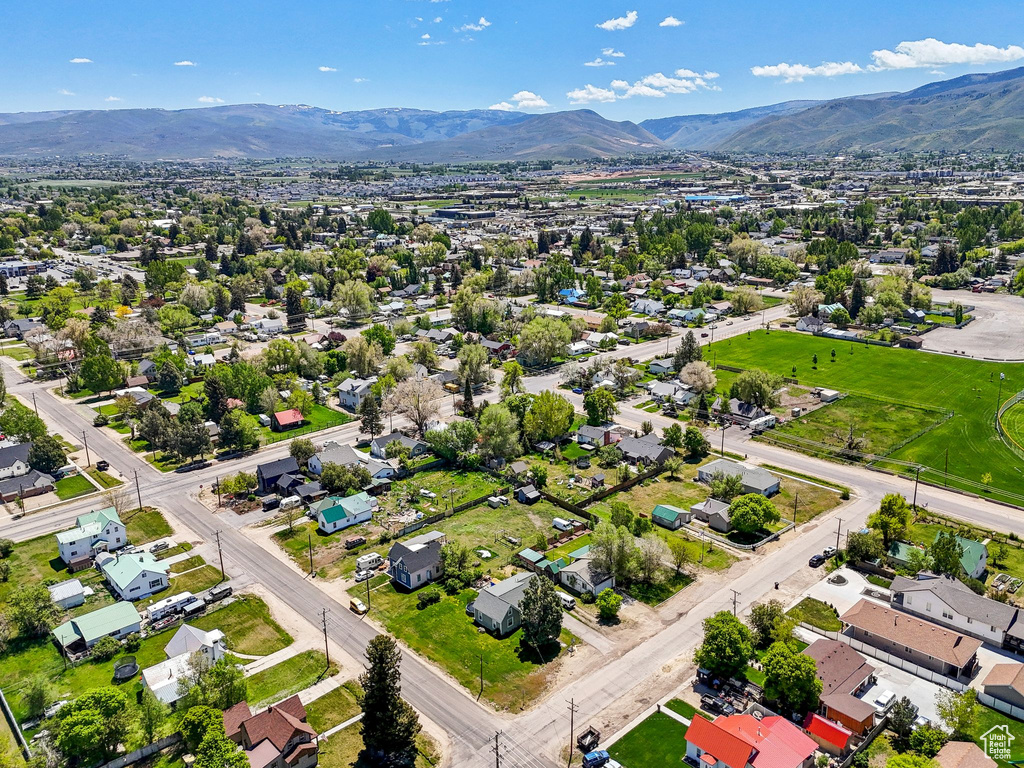 Aerial perspective of suburban area featuring a mountainous background