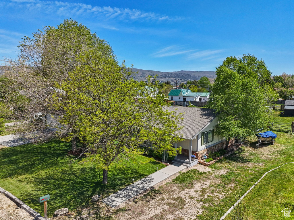 Aerial view of property and surrounding area featuring mountains