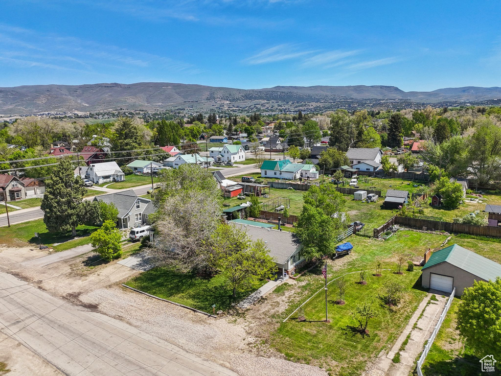 Aerial perspective of suburban area with a mountainous background
