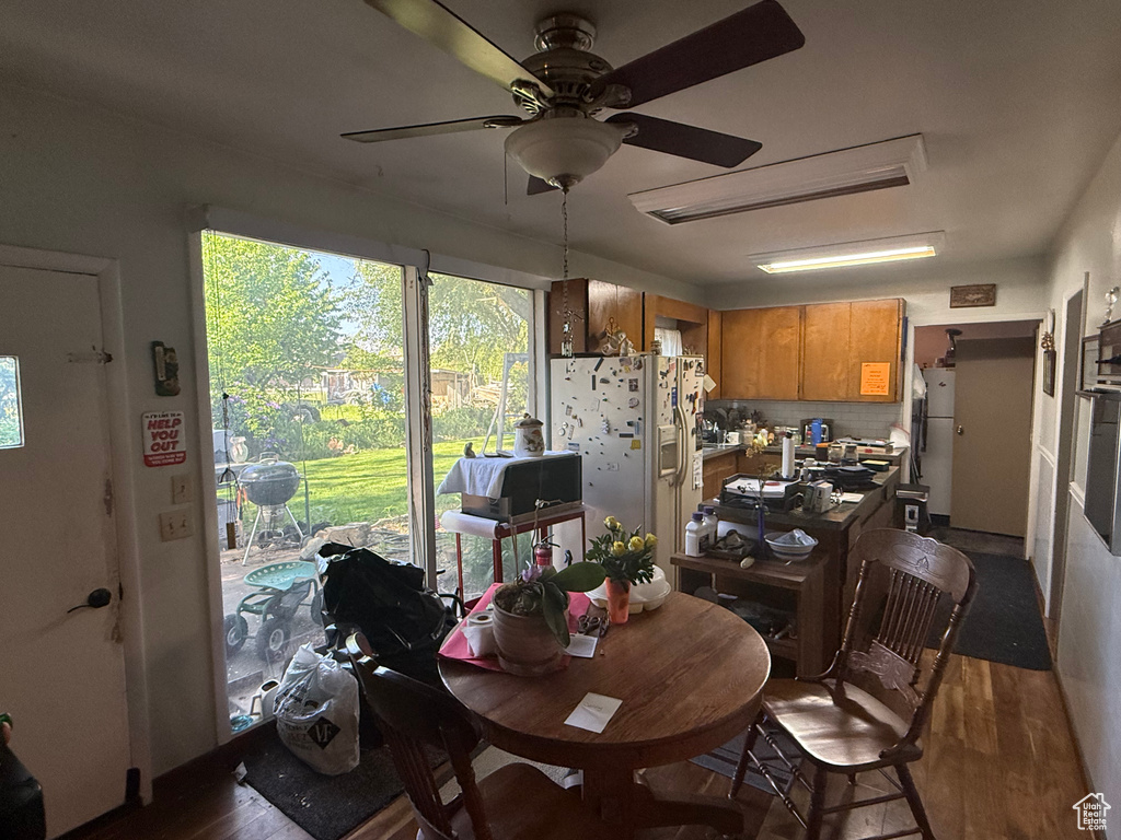 Dining space featuring wood finished floors and ceiling fan