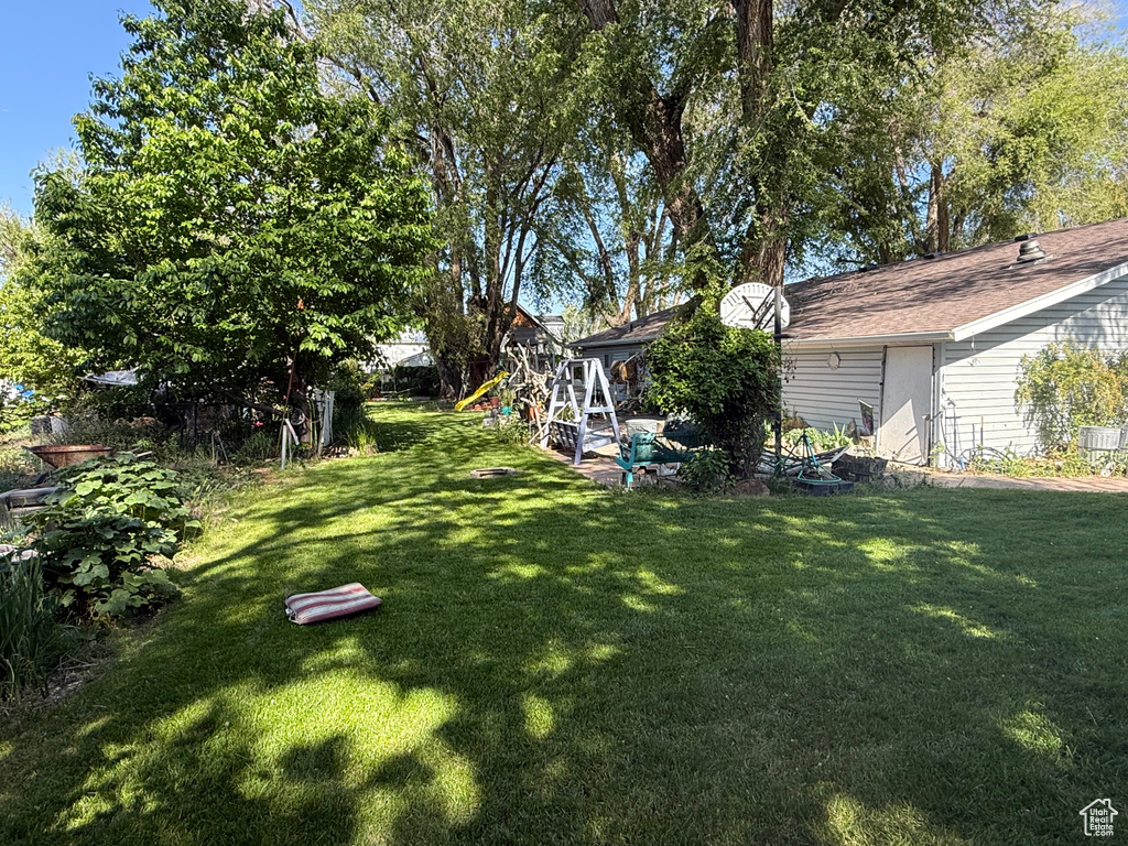 View of grassy yard with a playground
