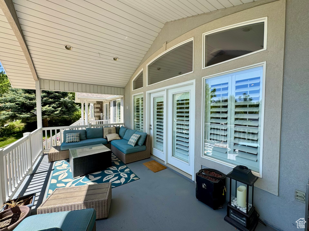 Wooden deck with an outdoor living space