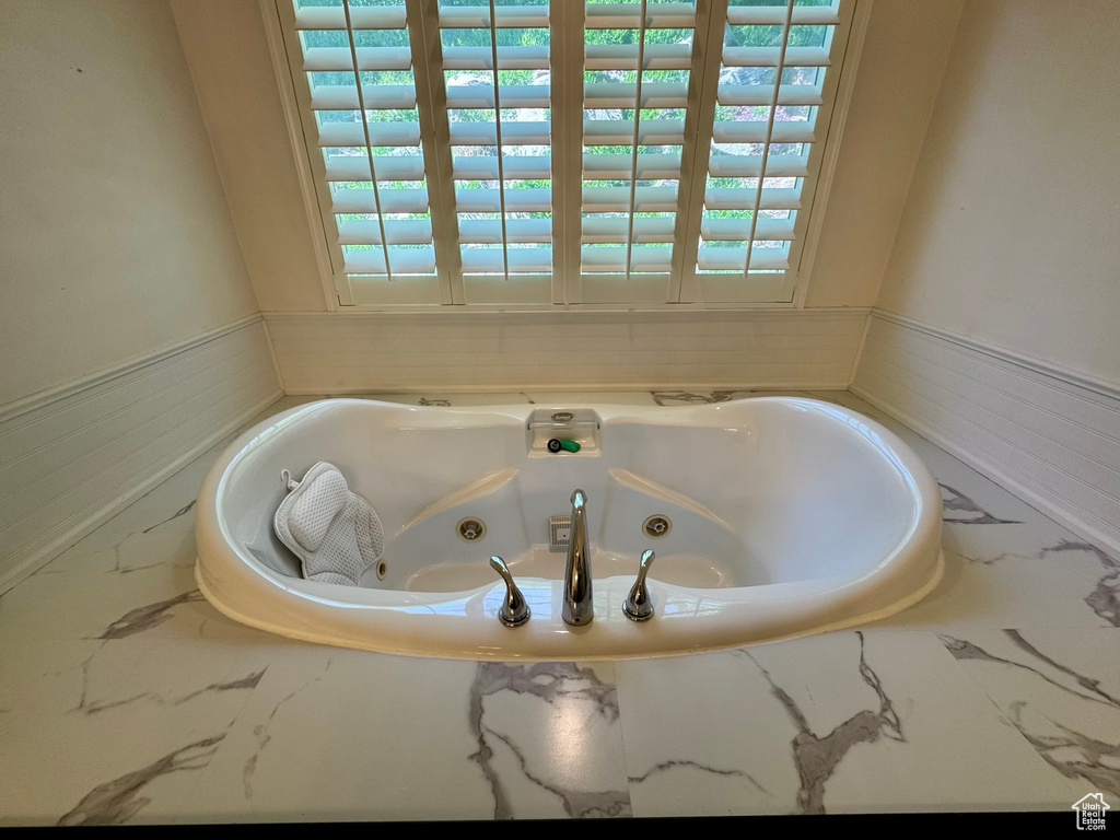 Bathroom with a tub with jets