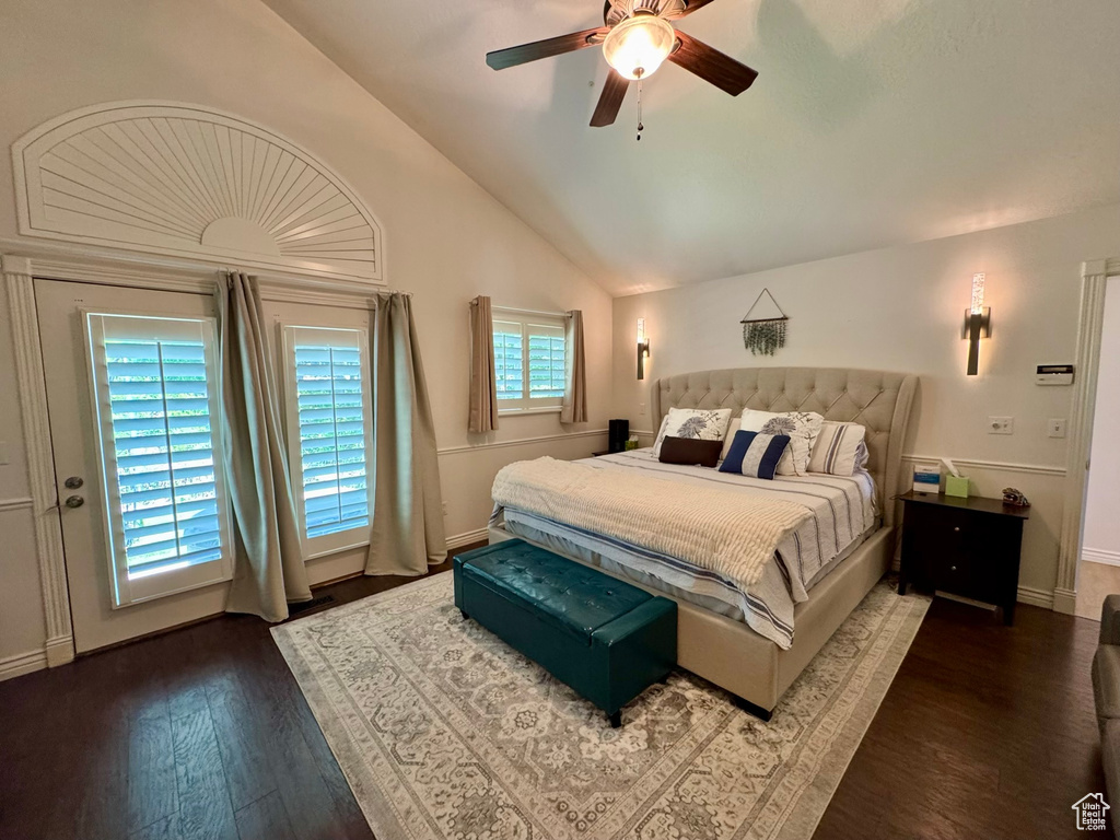 Bedroom featuring vaulted ceiling, wood finished floors, ceiling fan, and baseboards