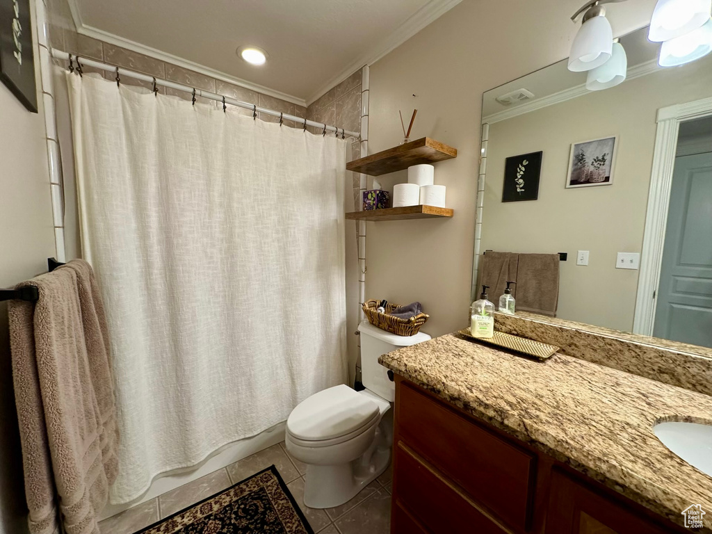 Full bath featuring toilet, tile patterned floors, vanity, crown molding, and a shower with shower curtain