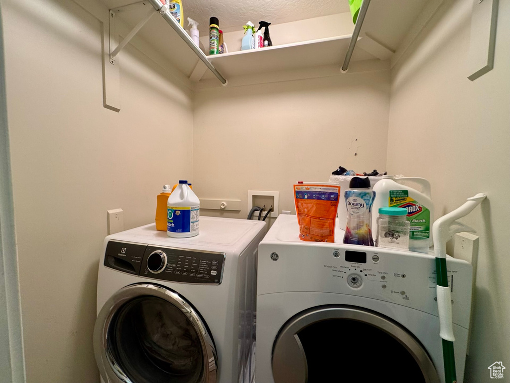 Washroom featuring washer and clothes dryer