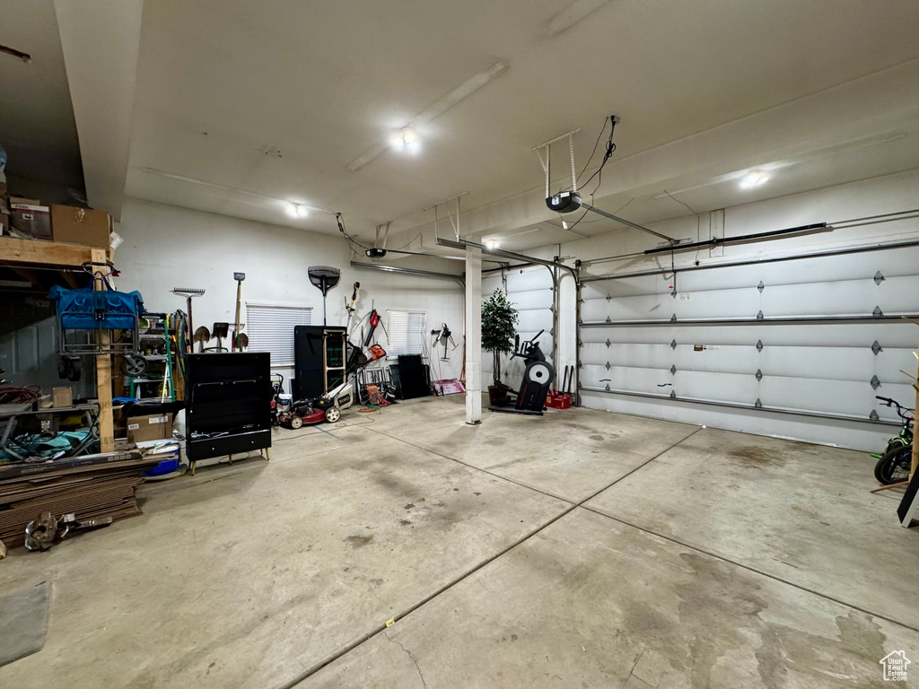 Garage featuring a garage door opener