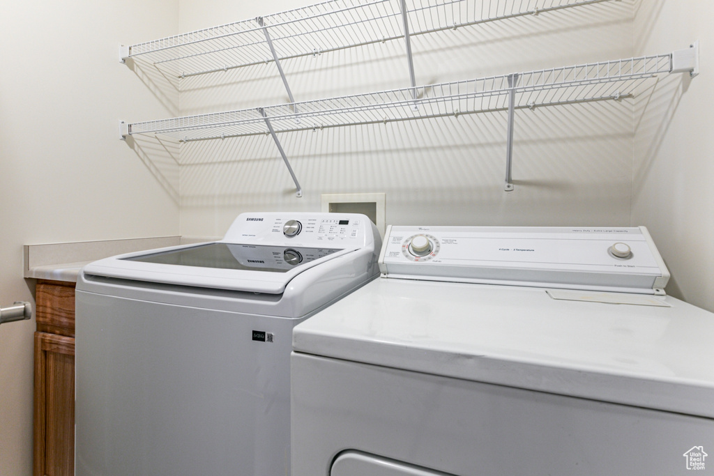 Washroom featuring washer and dryer
