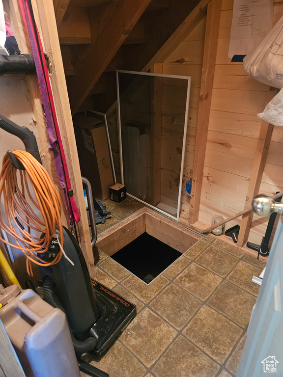 Bathroom featuring wood walls