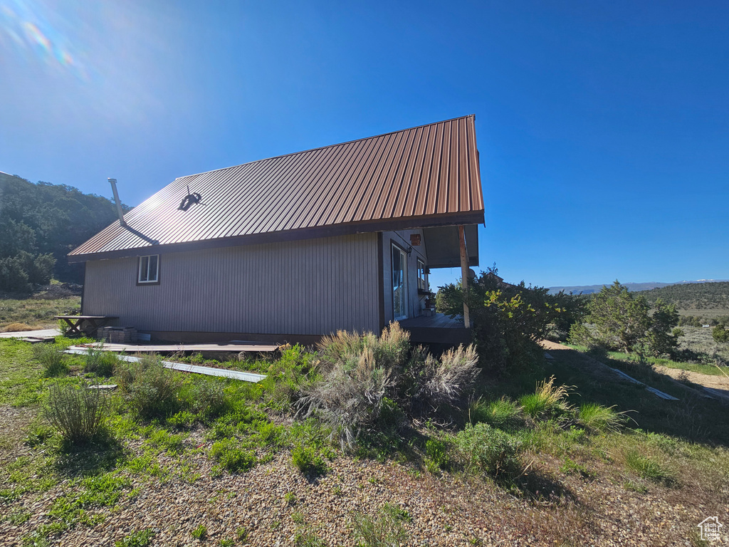 View of property exterior with metal roof