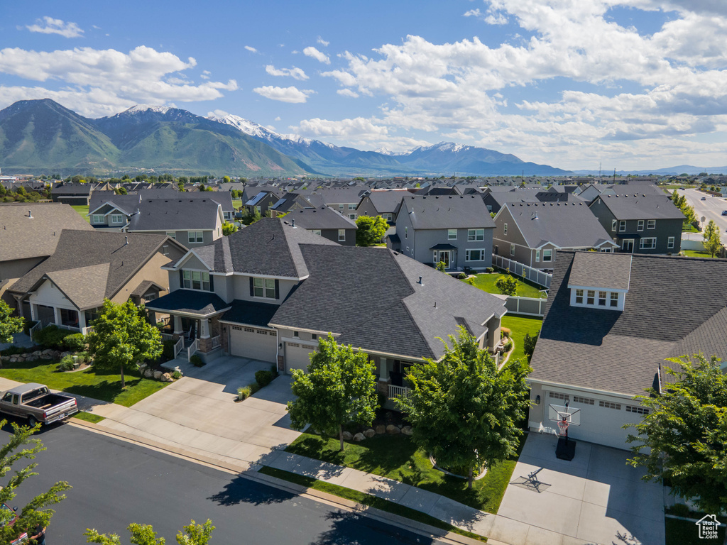 Aerial view of residential area featuring mountains