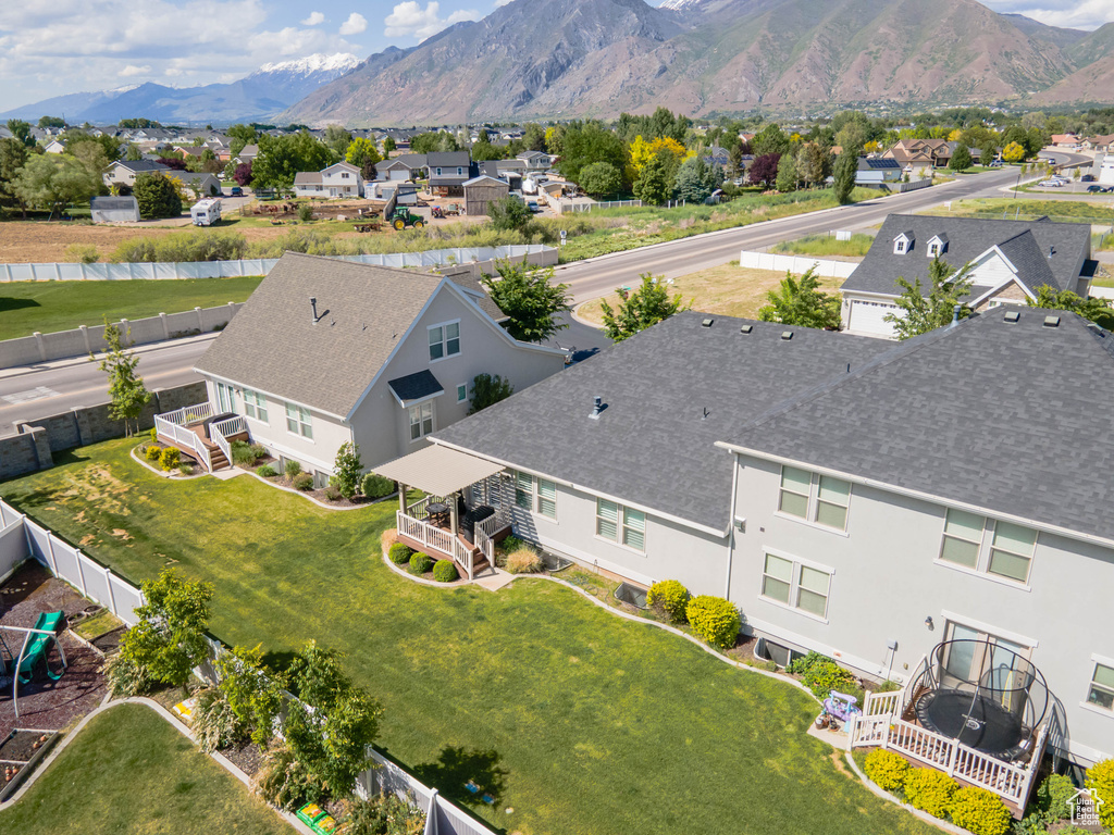 Aerial perspective of suburban area featuring a mountain backdrop