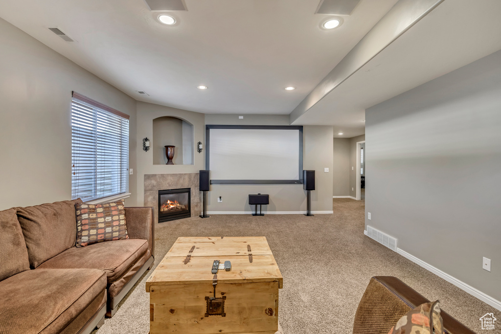 Home theater room featuring a fireplace, recessed lighting, baseboards, and carpet flooring