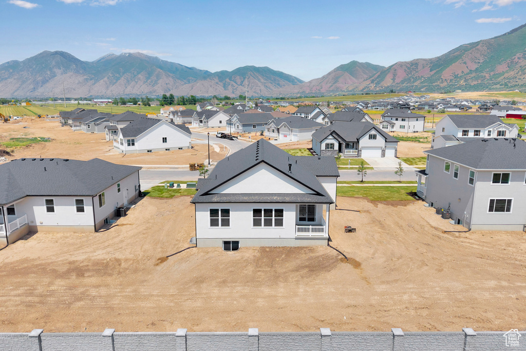 Aerial perspective of suburban area featuring a mountainous background