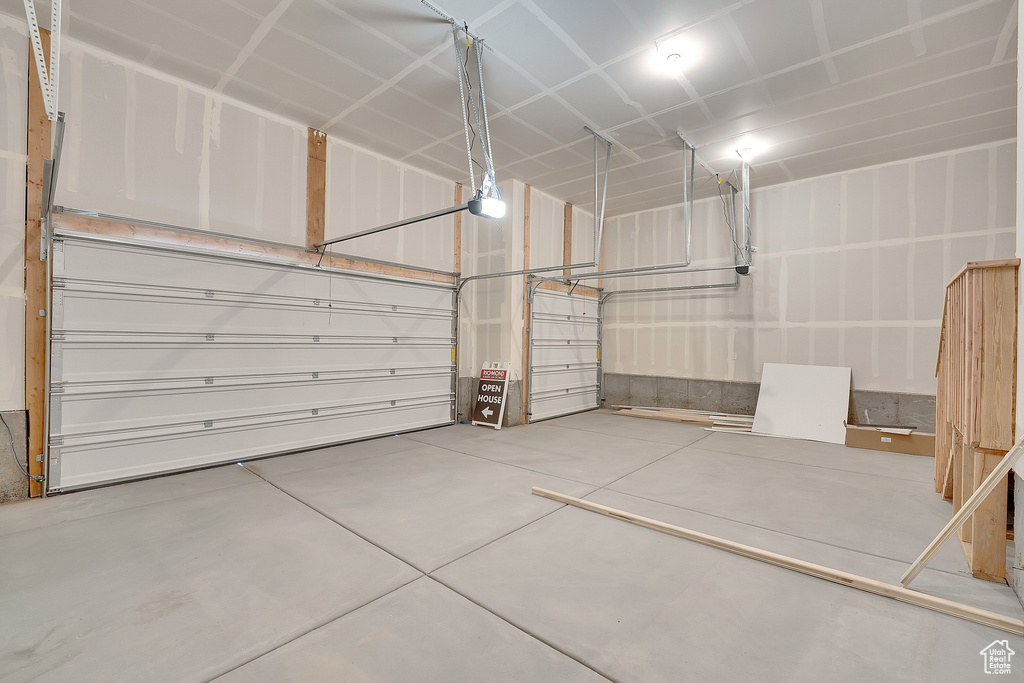 Garage featuring a garage door opener