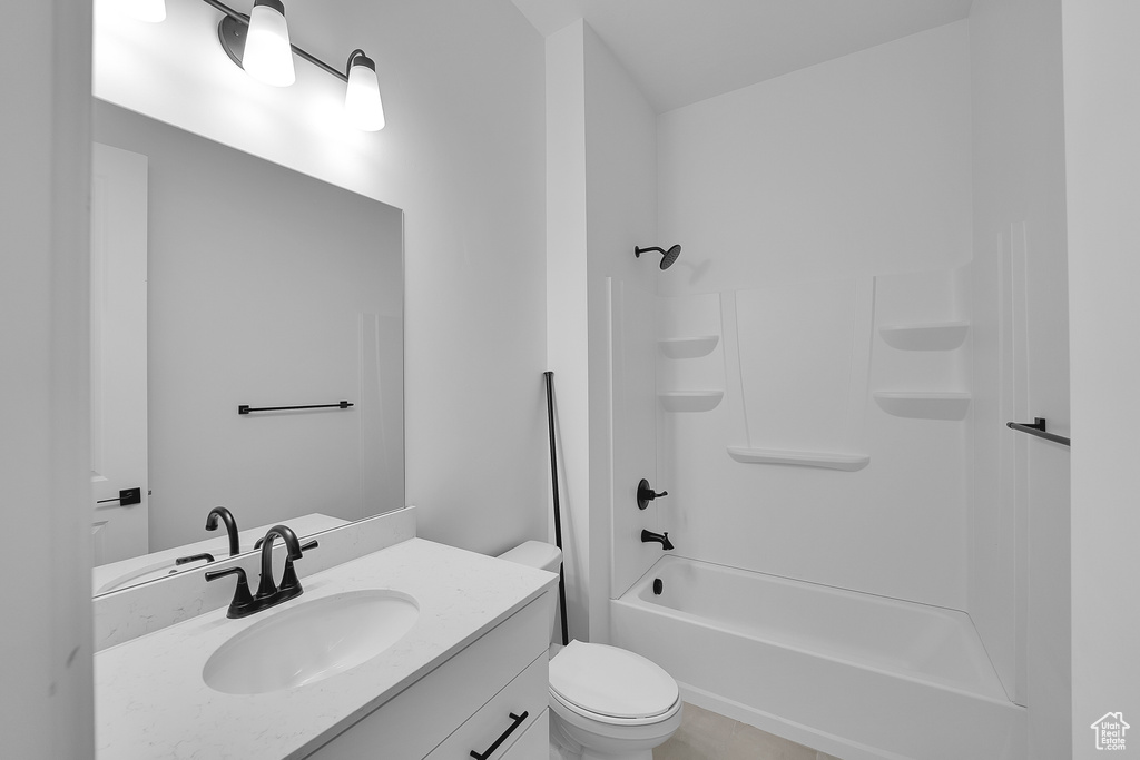 Full bathroom with vanity, toilet, and shower / bath combination