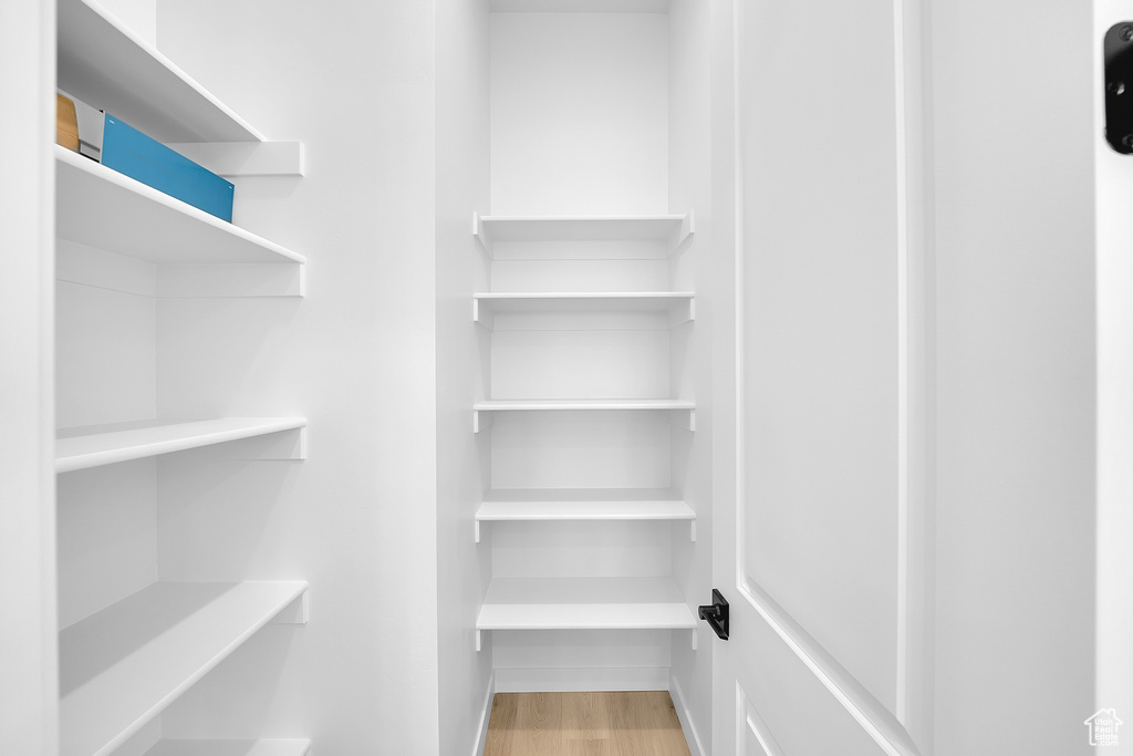 Spacious closet with light wood-style floors