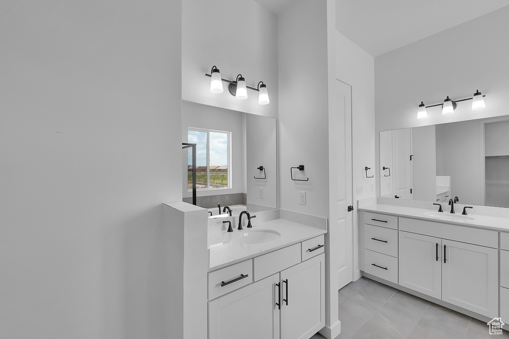Bathroom featuring two vanities