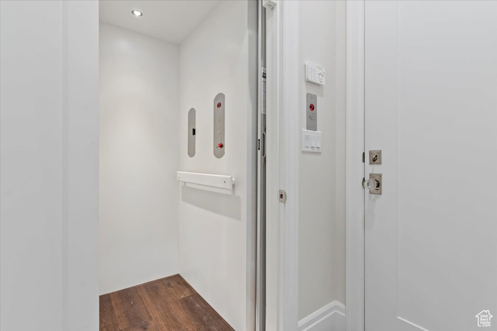Elevator with wood finished floors and recessed lighting