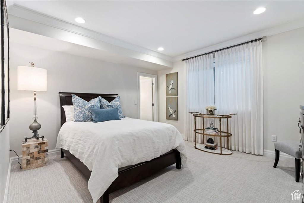Carpeted bedroom with crown molding, recessed lighting, and baseboards