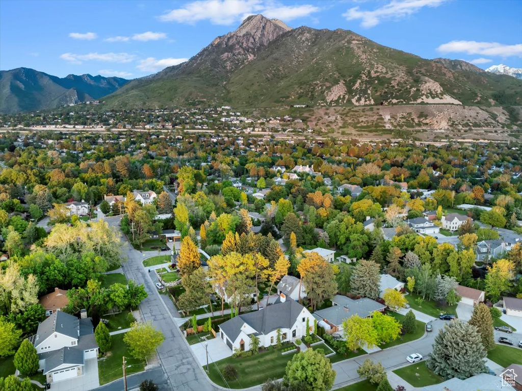 Aerial perspective of suburban area featuring a mountainous background