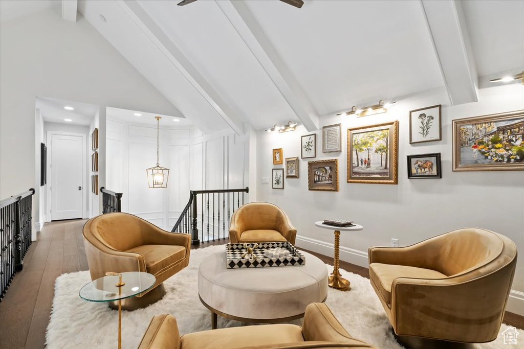 Living area with hardwood / wood-style floors, an upstairs landing, recessed lighting, and baseboards