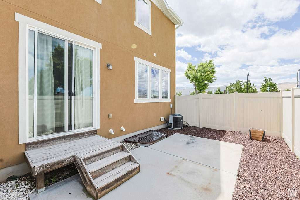 View of patio with central air condition unit