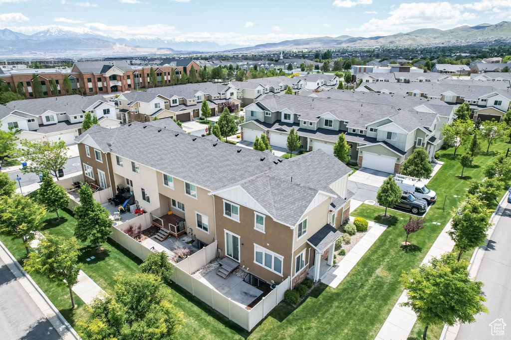 Aerial perspective of suburban area with a mountainous background