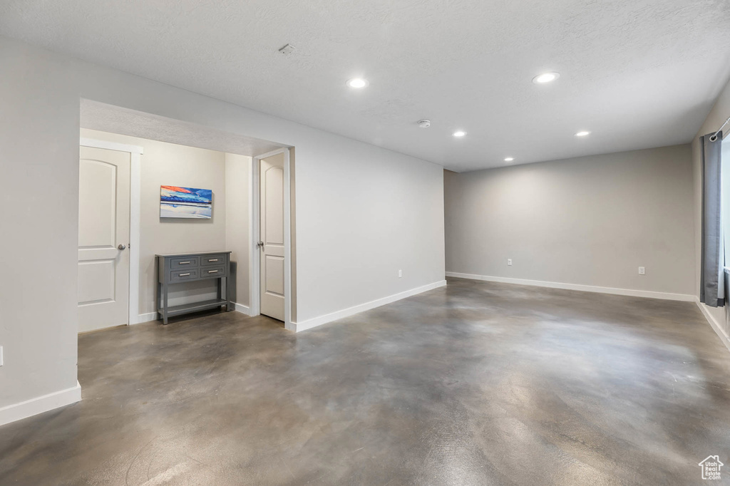 Below grade area featuring recessed lighting and baseboards