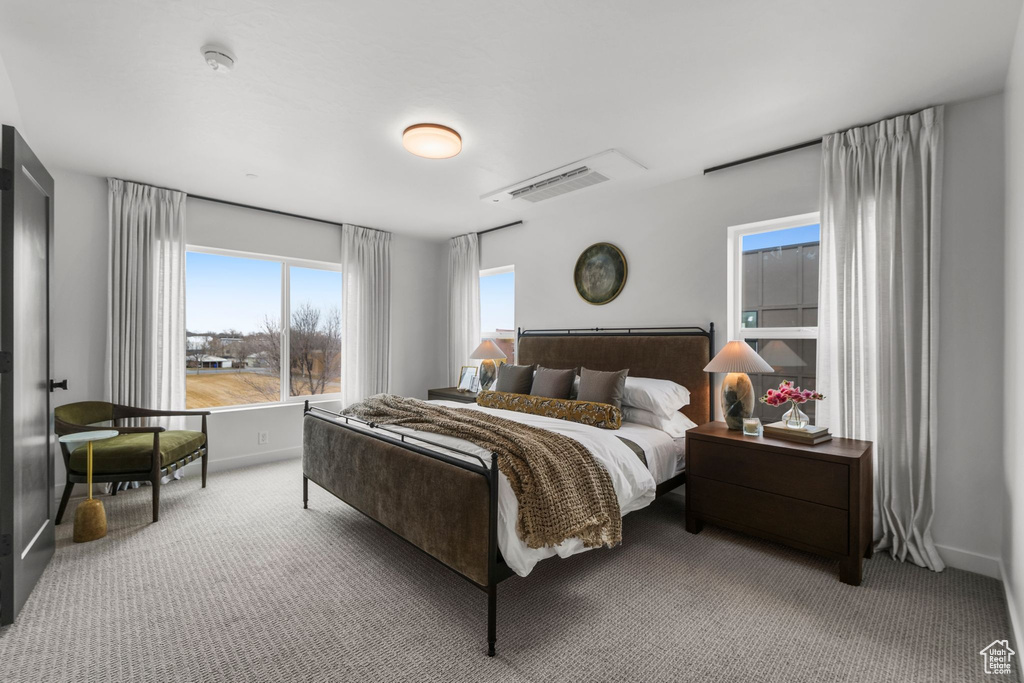 Carpeted bedroom featuring baseboards
