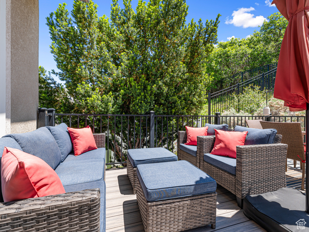 Wooden terrace with an outdoor living space