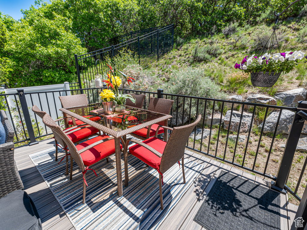 Wooden terrace featuring outdoor dining space