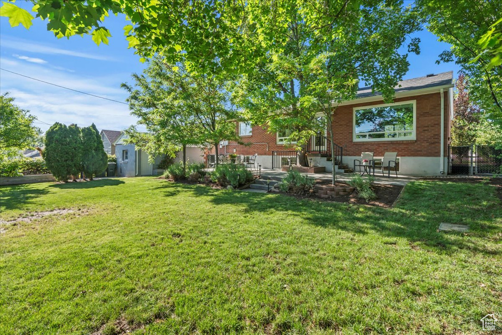View of yard with a patio