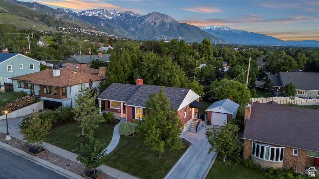 Aerial perspective of suburban area with a mountainous background