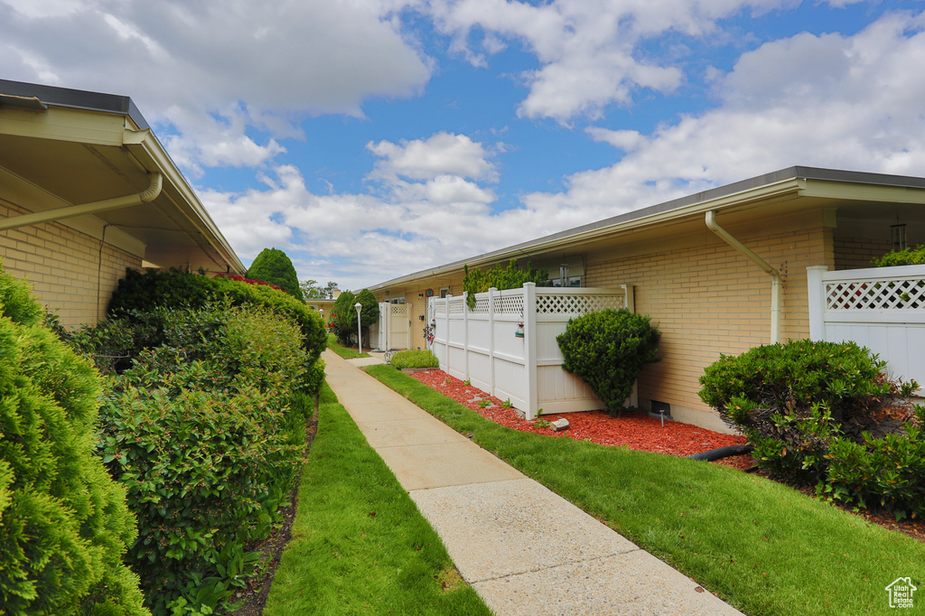 View of side of property featuring brick siding