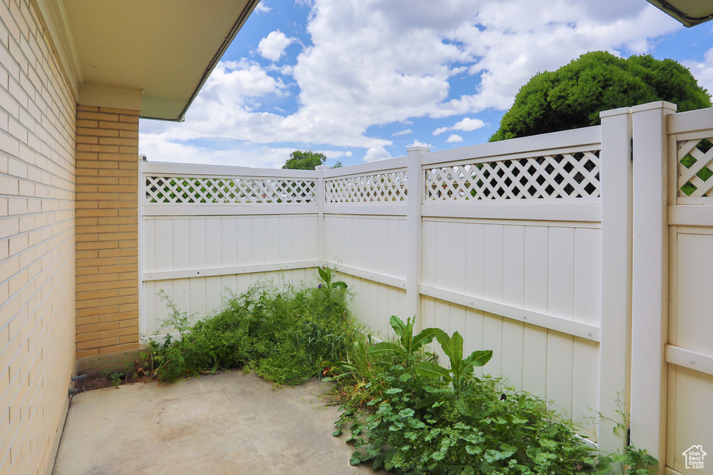Fenced backyard featuring a patio