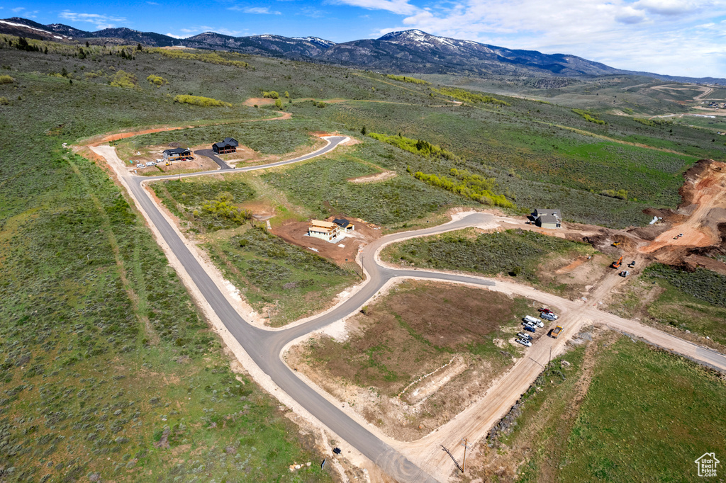 Aerial overview of property's location with mountains and rural landscape