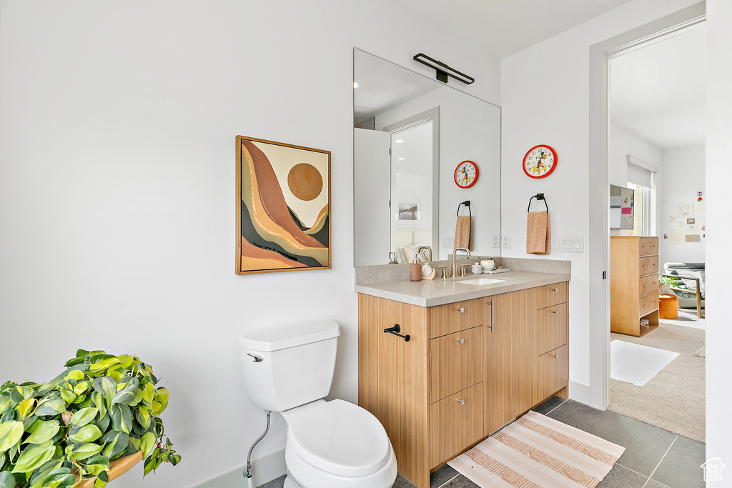 Bathroom with toilet and vanity