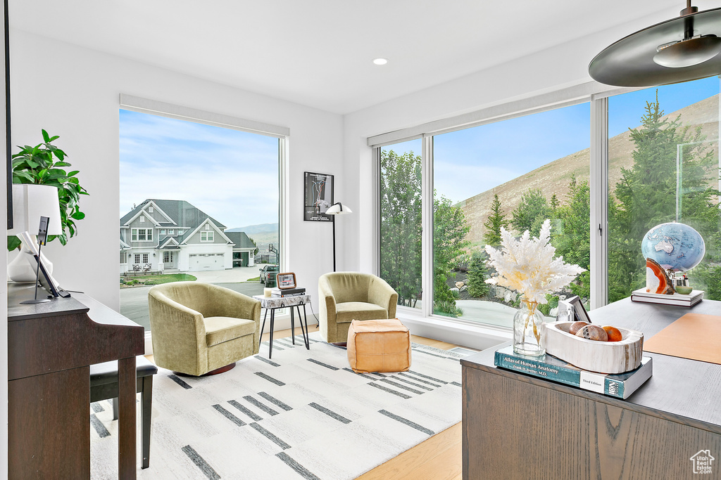Living area with light wood-type flooring, recessed lighting, and a mountain view