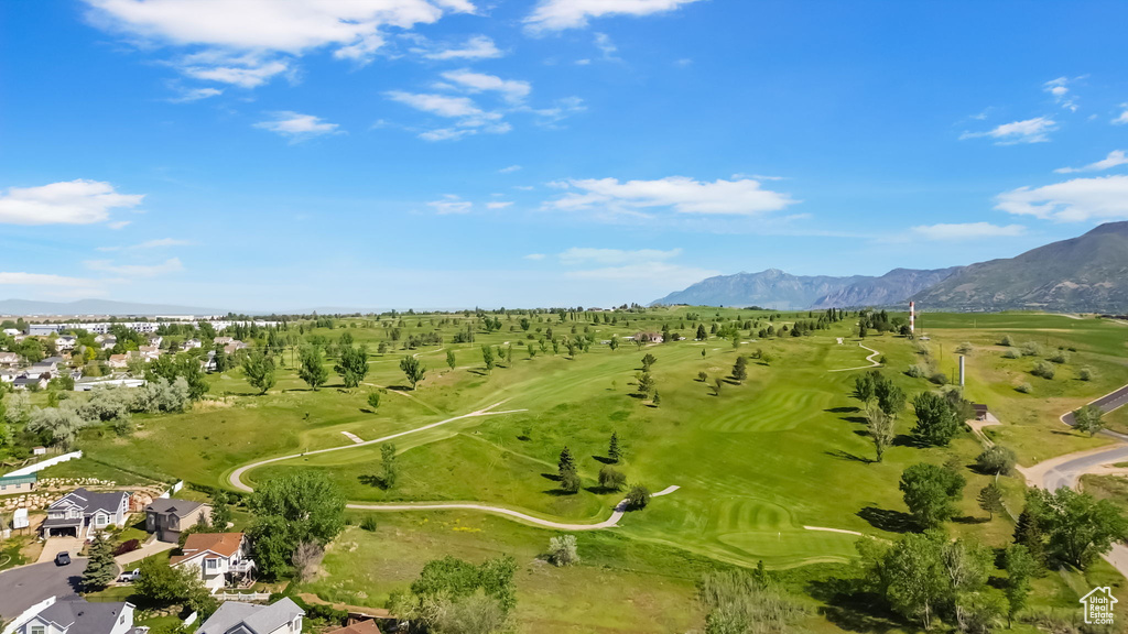 Bird's eye view of a mountainous background and a golf club