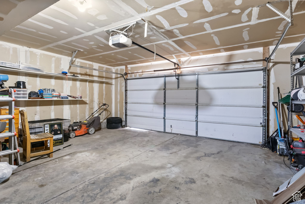 Garage featuring a garage door opener