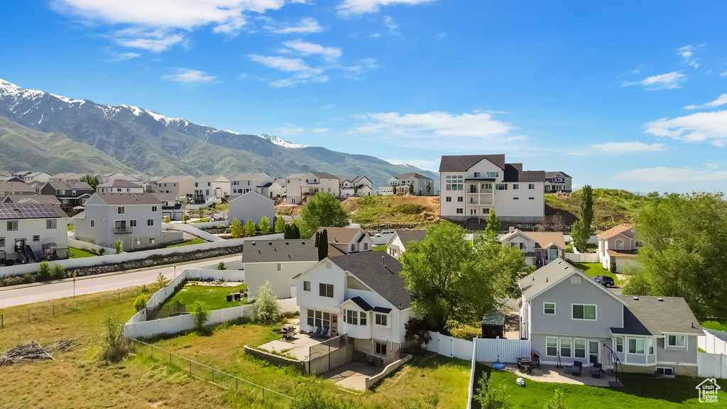 Aerial view of residential area featuring mountains