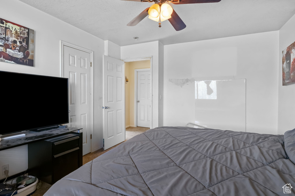 Bedroom featuring carpet floors and a ceiling fan