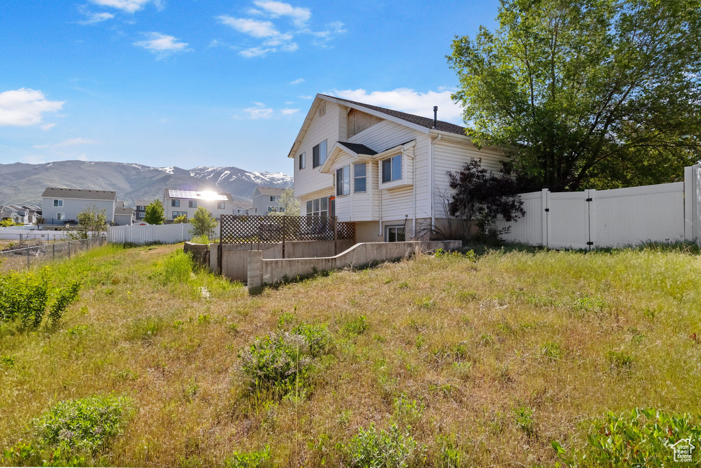 Rear view of property featuring a mountain view
