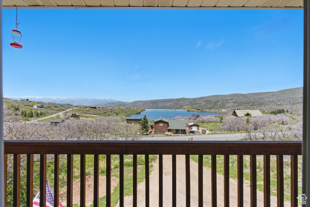 Exterior space featuring a water and mountain view