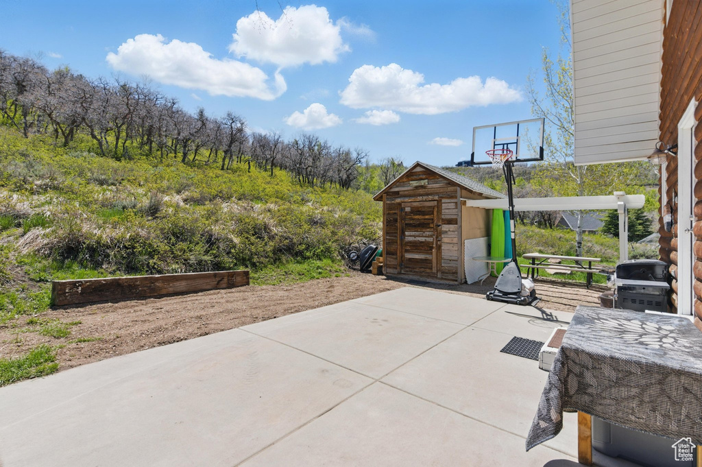 View of patio featuring area for grilling